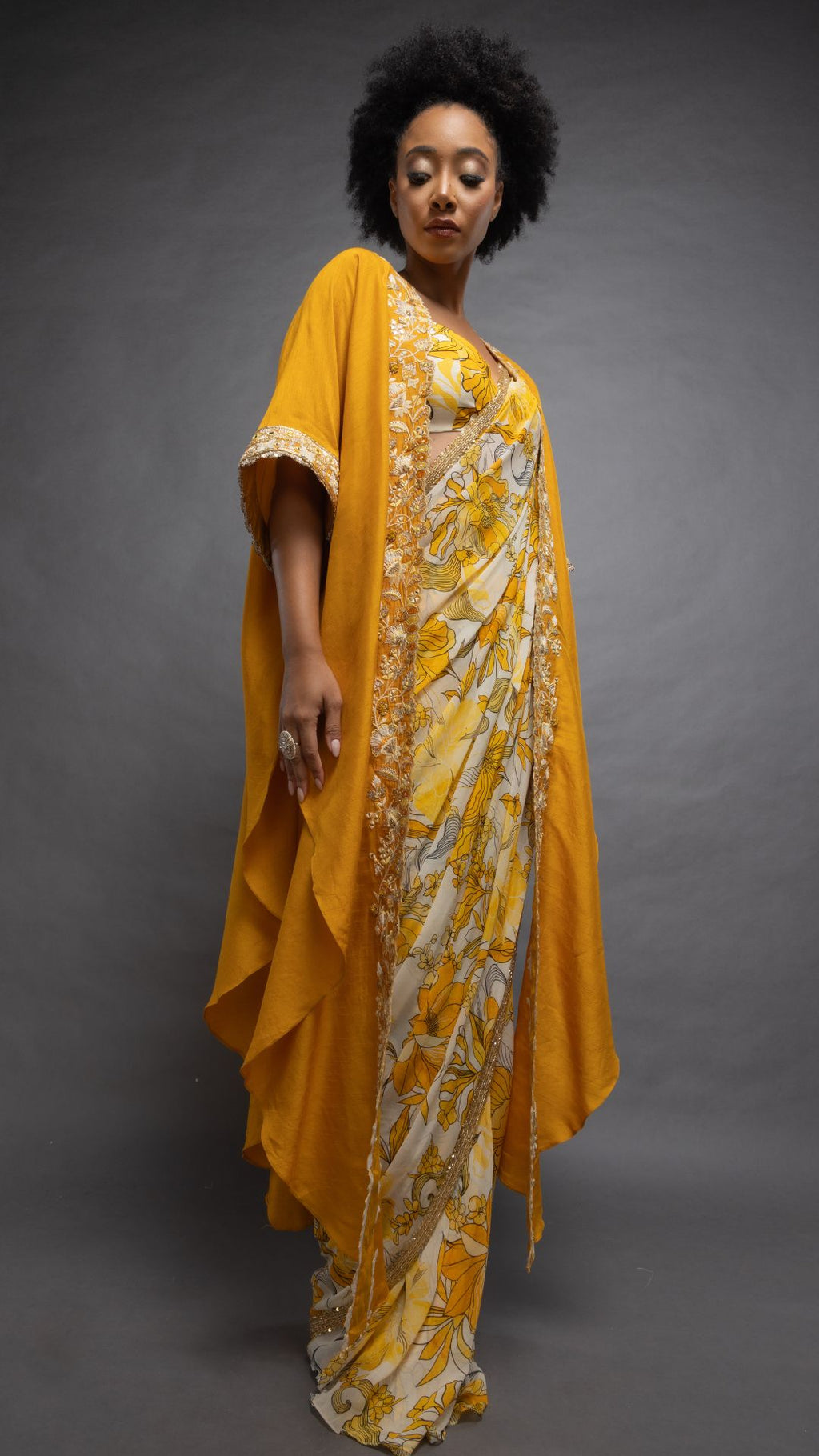 Musturd Printed Saree with Printed Bustier and Musturd Circular Cape with Slit Sleeve