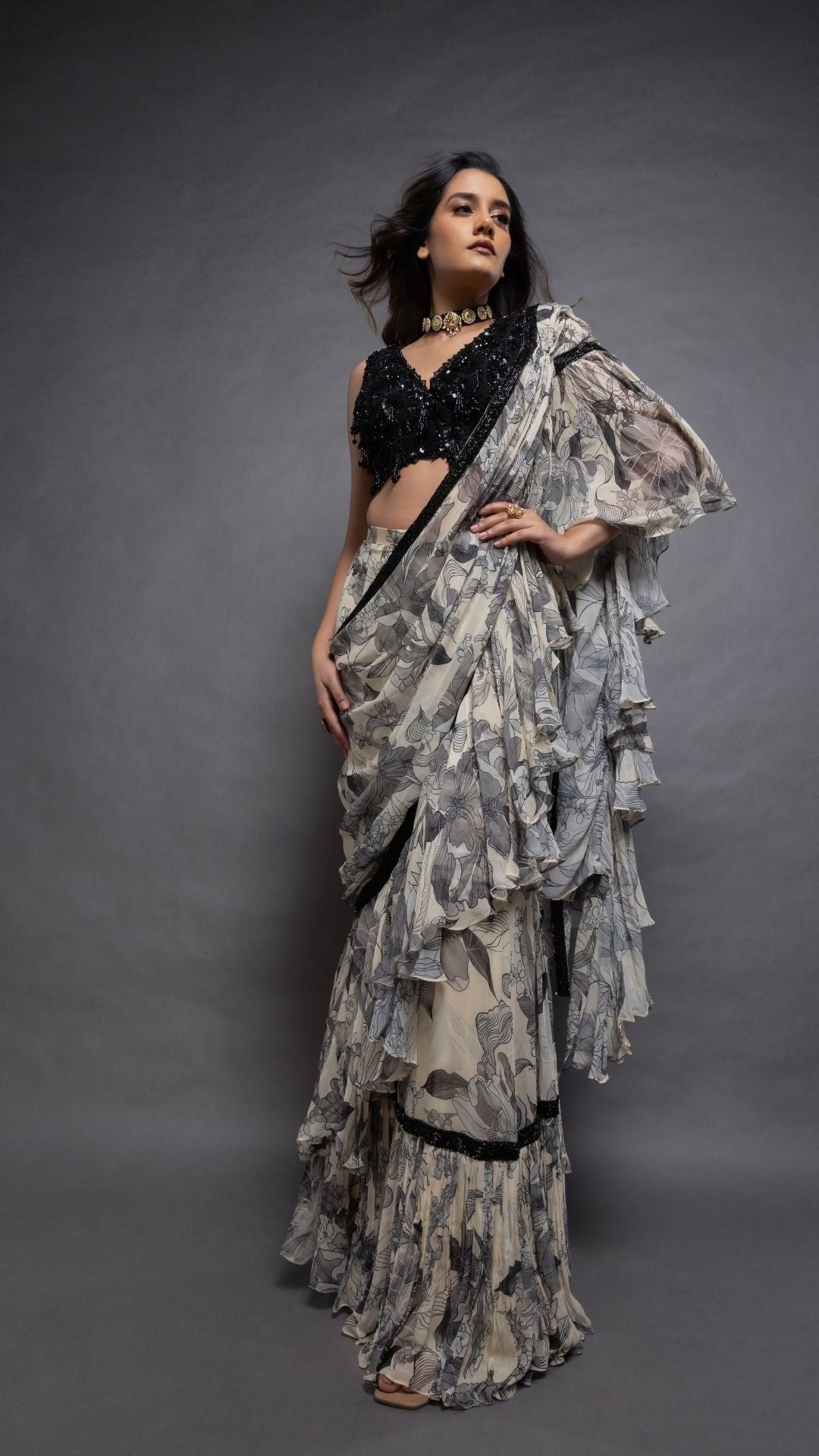 Grey Floral Abstract Printed Big Frill Saree with Black V-Neck Embroidered Cutwork Choli
