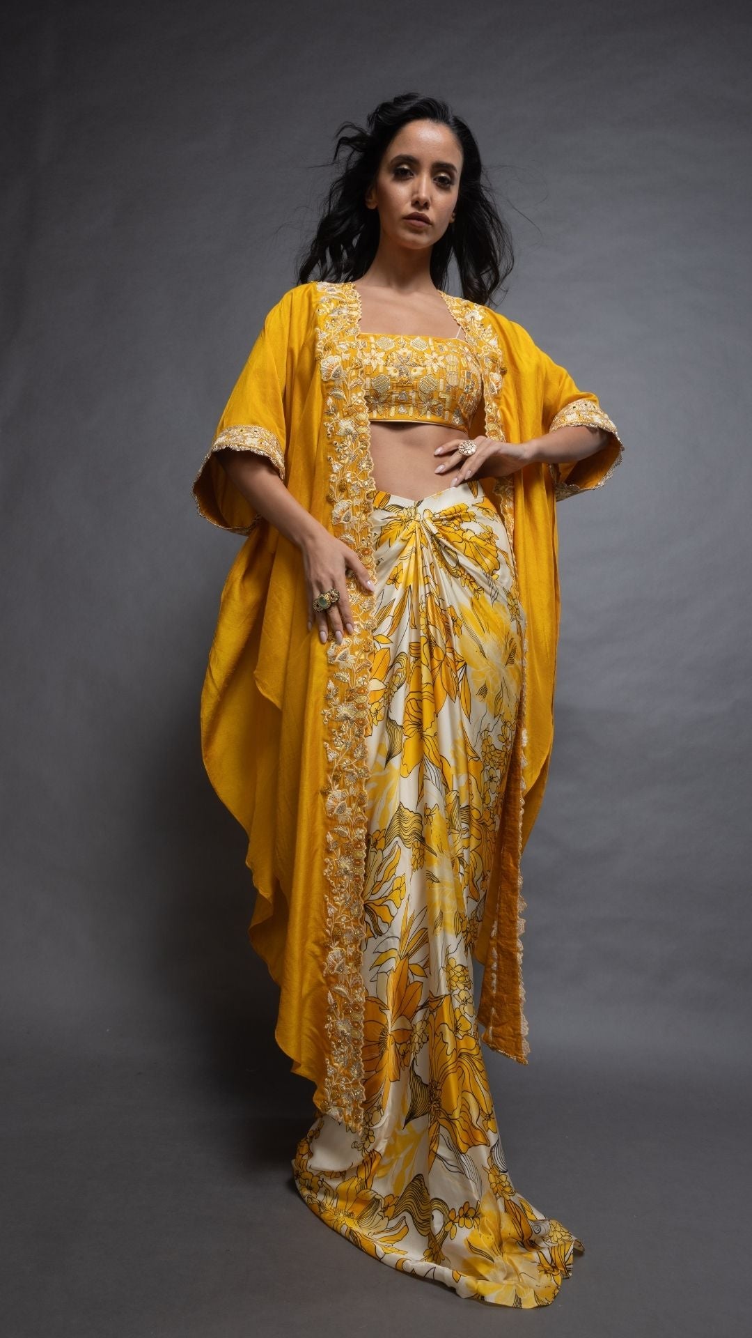 Musturd Silk Cutwork Cape with Embroidered Bustier and Printed Modal Drape Skirt