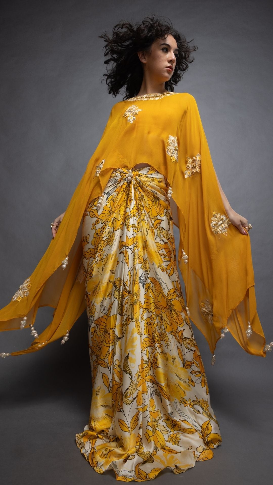 Mustard Embroidered Short Closed Neck Poncho with A Bustier and Floral Abstract Printed Drape Skirt