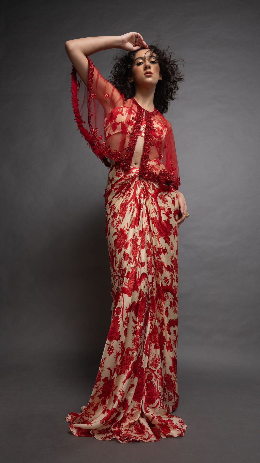 Solid Red Embroidered Single Button Short Cape with Abstract Printed Bustier and Floral Jaal Printed Drape Skirt