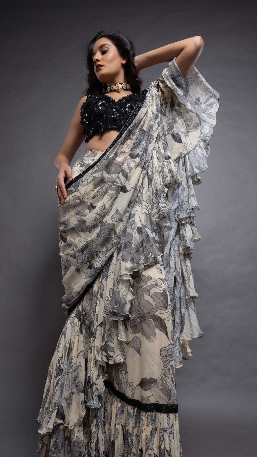 Grey Floral Abstract Printed Big Frill Saree with Black V-Neck Embroidered Cutwork Choli