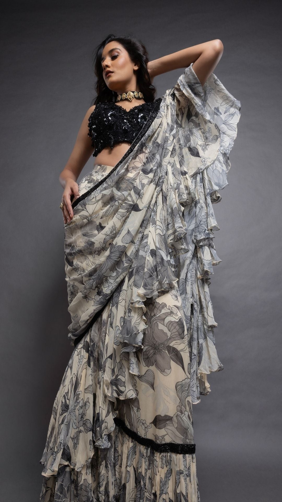 Grey Floral Abstract Printed Big Frill Saree with Black V-Neck Embroidered Cutwork Choli
