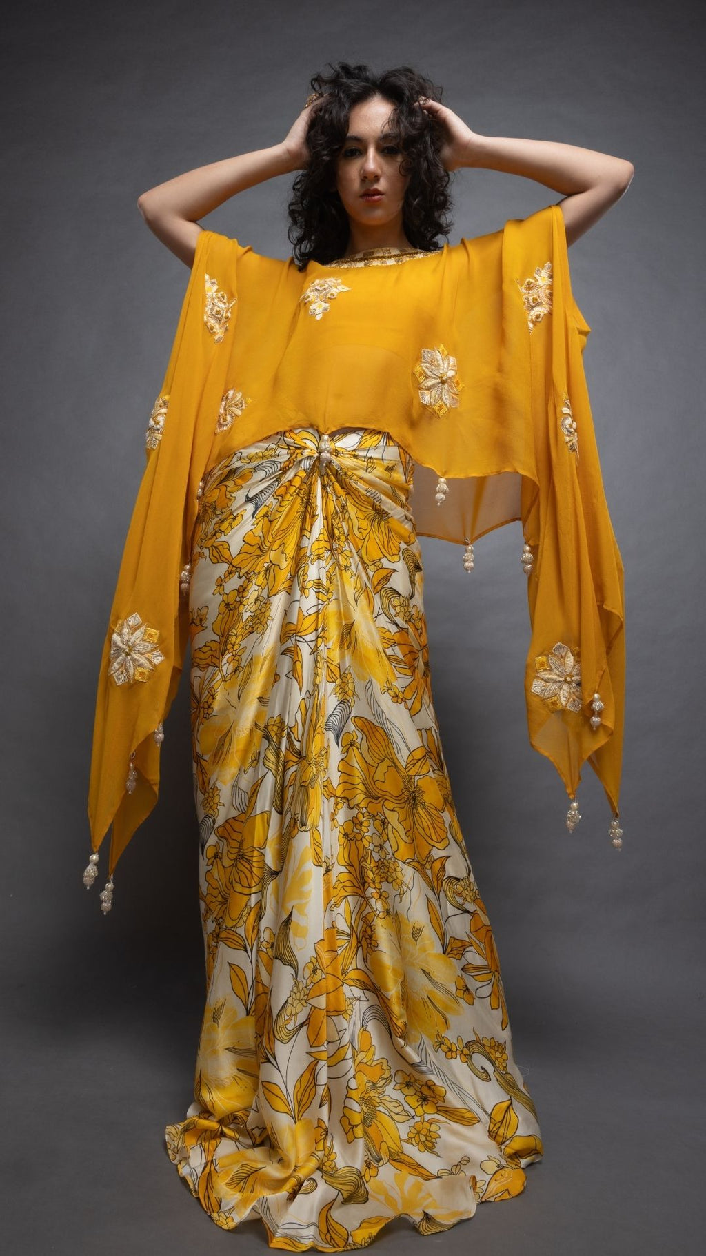 Mustard Embroidered Short Closed Neck Poncho with A Bustier and Floral Abstract Printed Drape Skirt