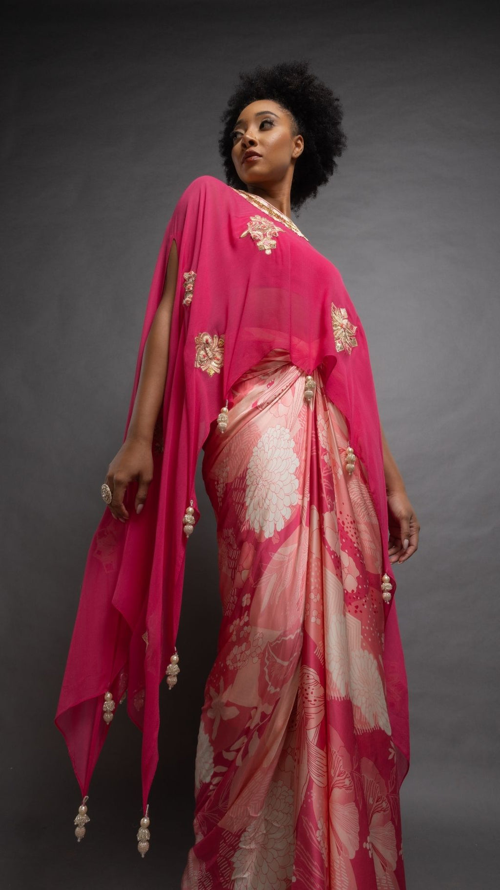 Pink Embroidered Short Closed Neck Poncho with A Bustier and Floral Jaal Printed Drape Skirt