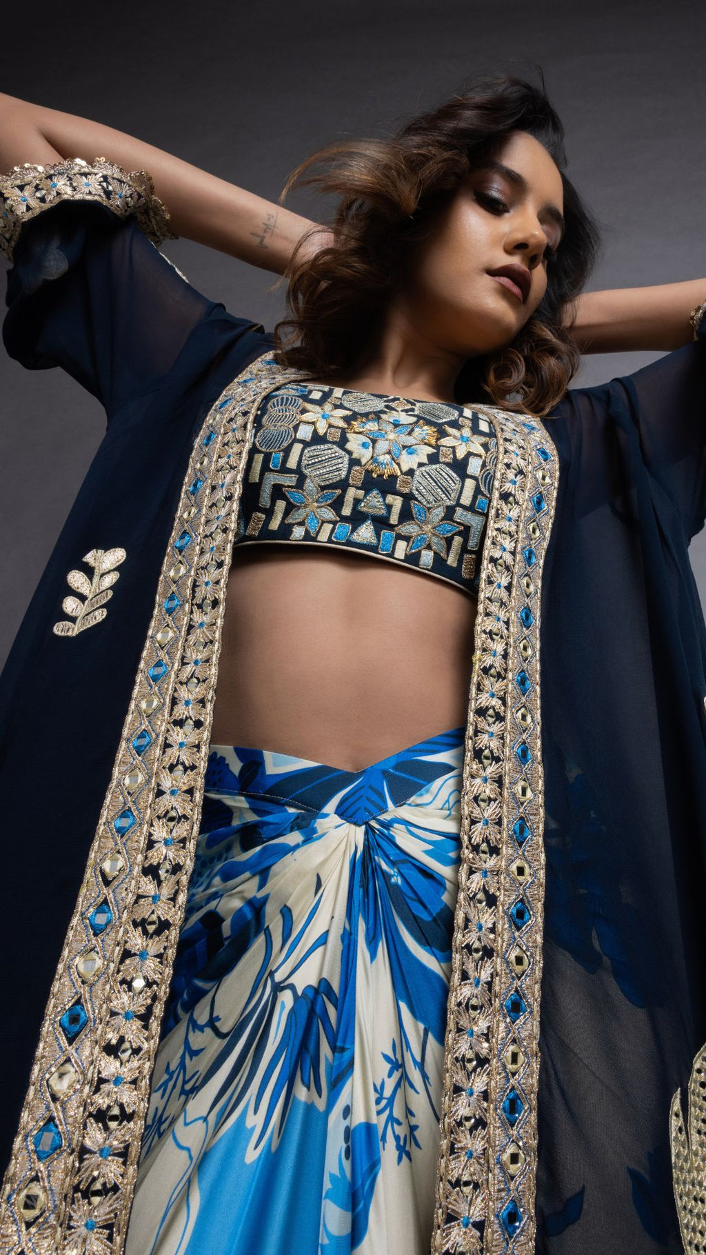 Solid Blue Embroidered Waterfall Cape with Embroiderd Bustier and Abstract Floral Printed Drape Skirt