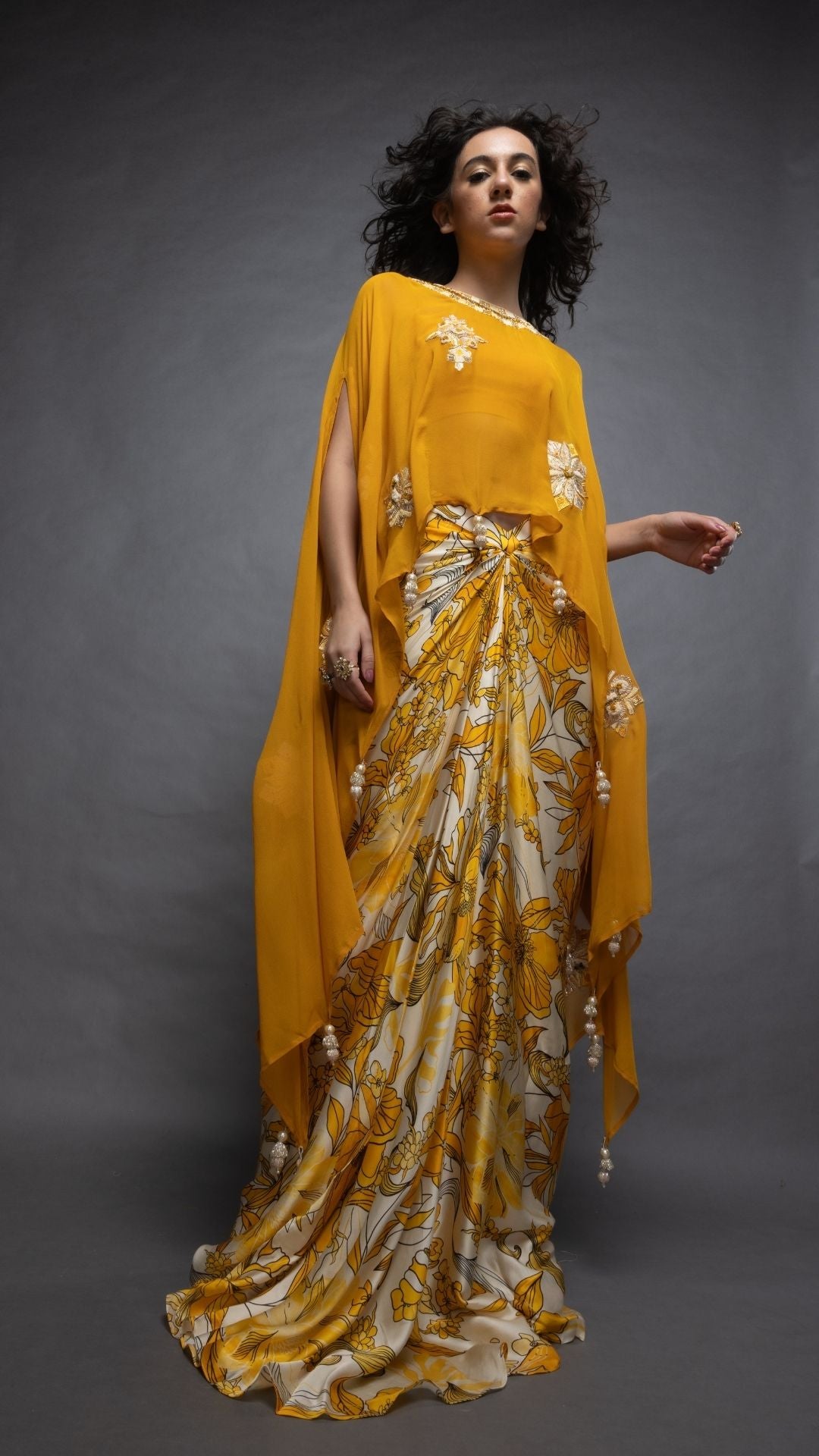 Mustard Embroidered Short Closed Neck Poncho with A Bustier and Floral Abstract Printed Drape Skirt
