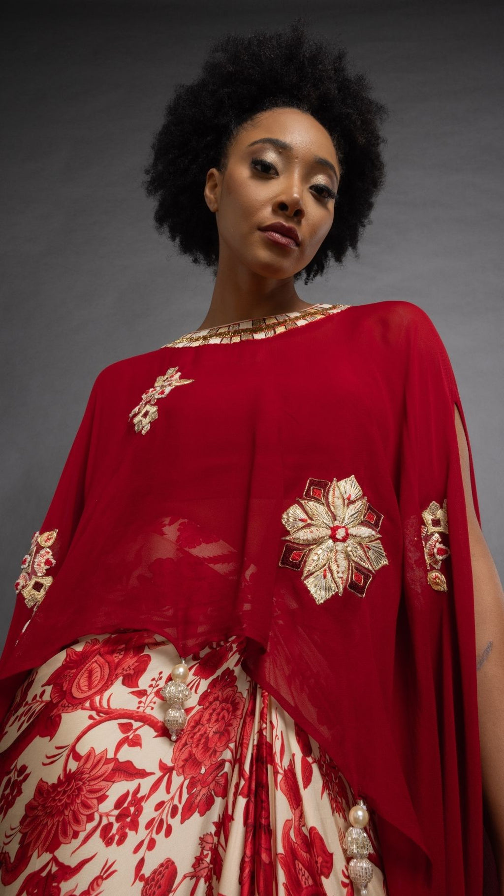 Red Embroidered Short Closed Neck Poncho with A Bustier and Floral Jaal Printed Drape Skirt