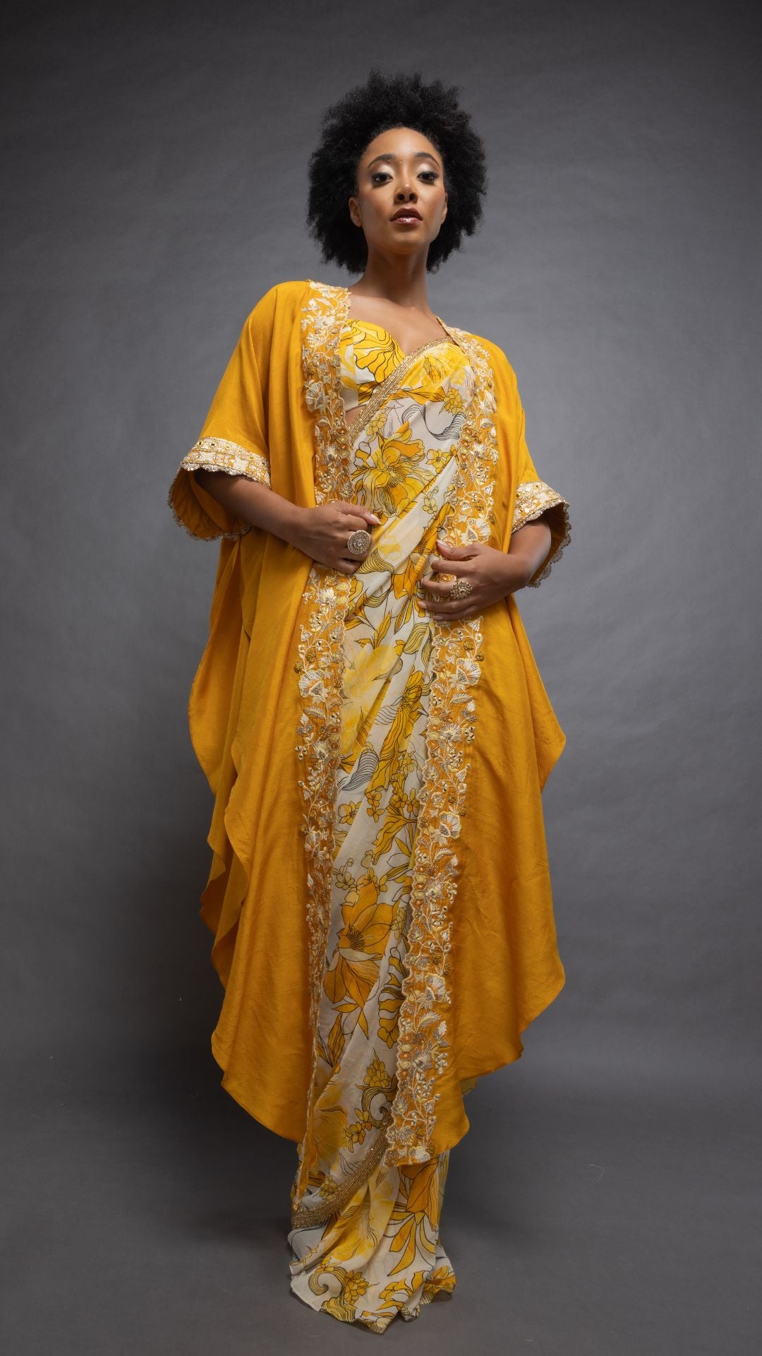 Musturd Printed Saree with Printed Bustier and Musturd Circular Cape with Slit Sleeve
