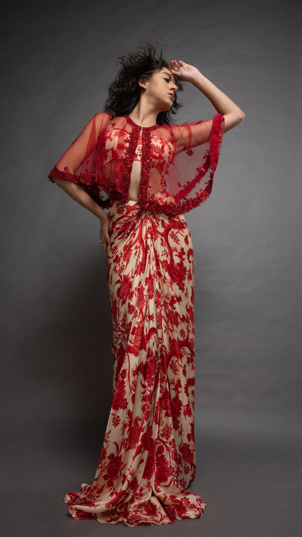 Solid Red Embroidered Single Button Short Cape with Abstract Printed Bustier and Floral Jaal Printed Drape Skirt