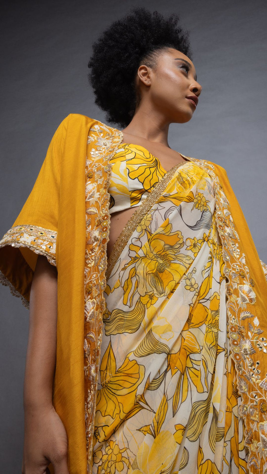 Musturd Printed Saree with Printed Bustier and Musturd Circular Cape with Slit Sleeve