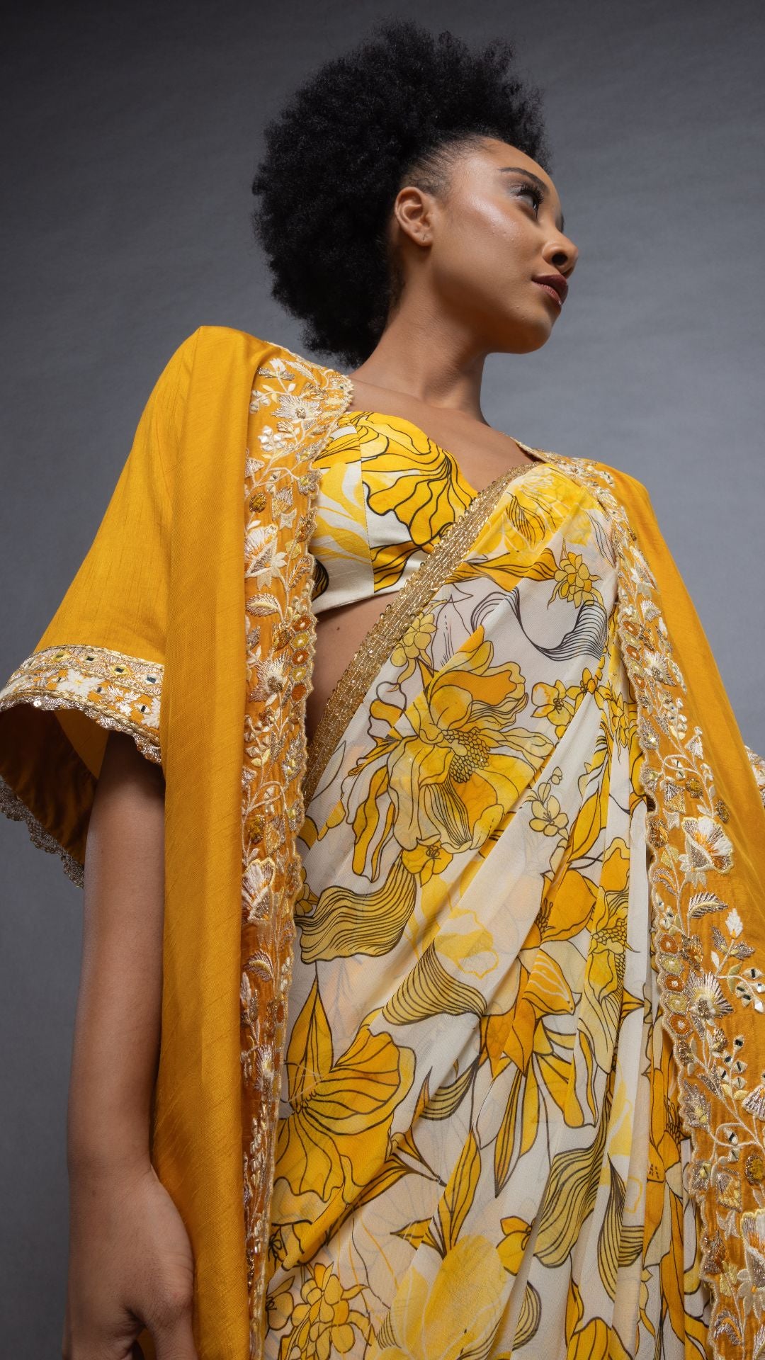 Musturd Printed Saree with Printed Bustier and Musturd Circular Cape with Slit Sleeve