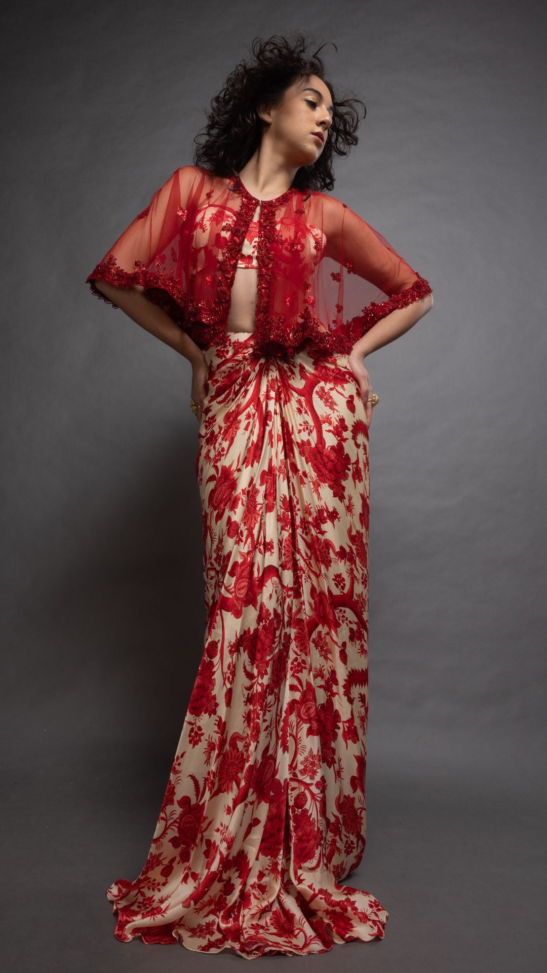 Solid Red Embroidered Single Button Short Cape with Abstract Printed Bustier and Floral Jaal Printed Drape Skirt