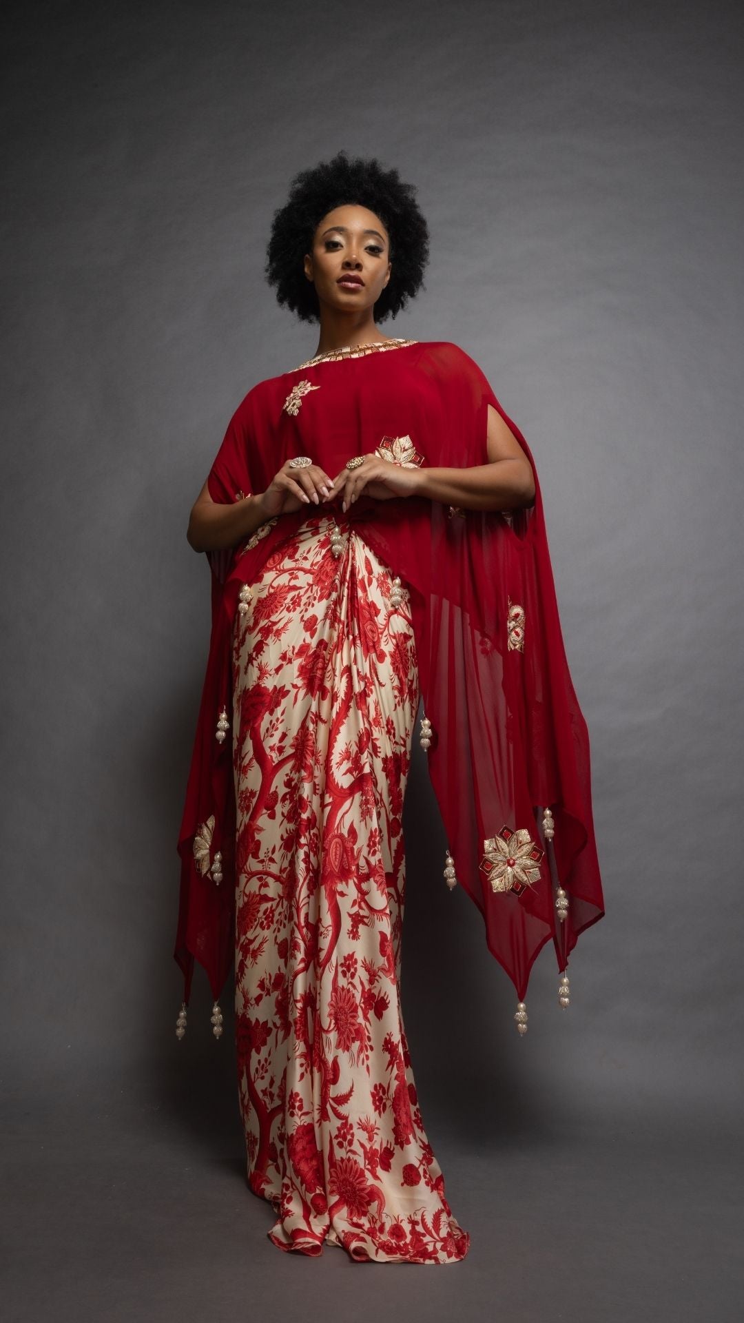 Red Embroidered Short Closed Neck Poncho with A Bustier and Floral Jaal Printed Drape Skirt