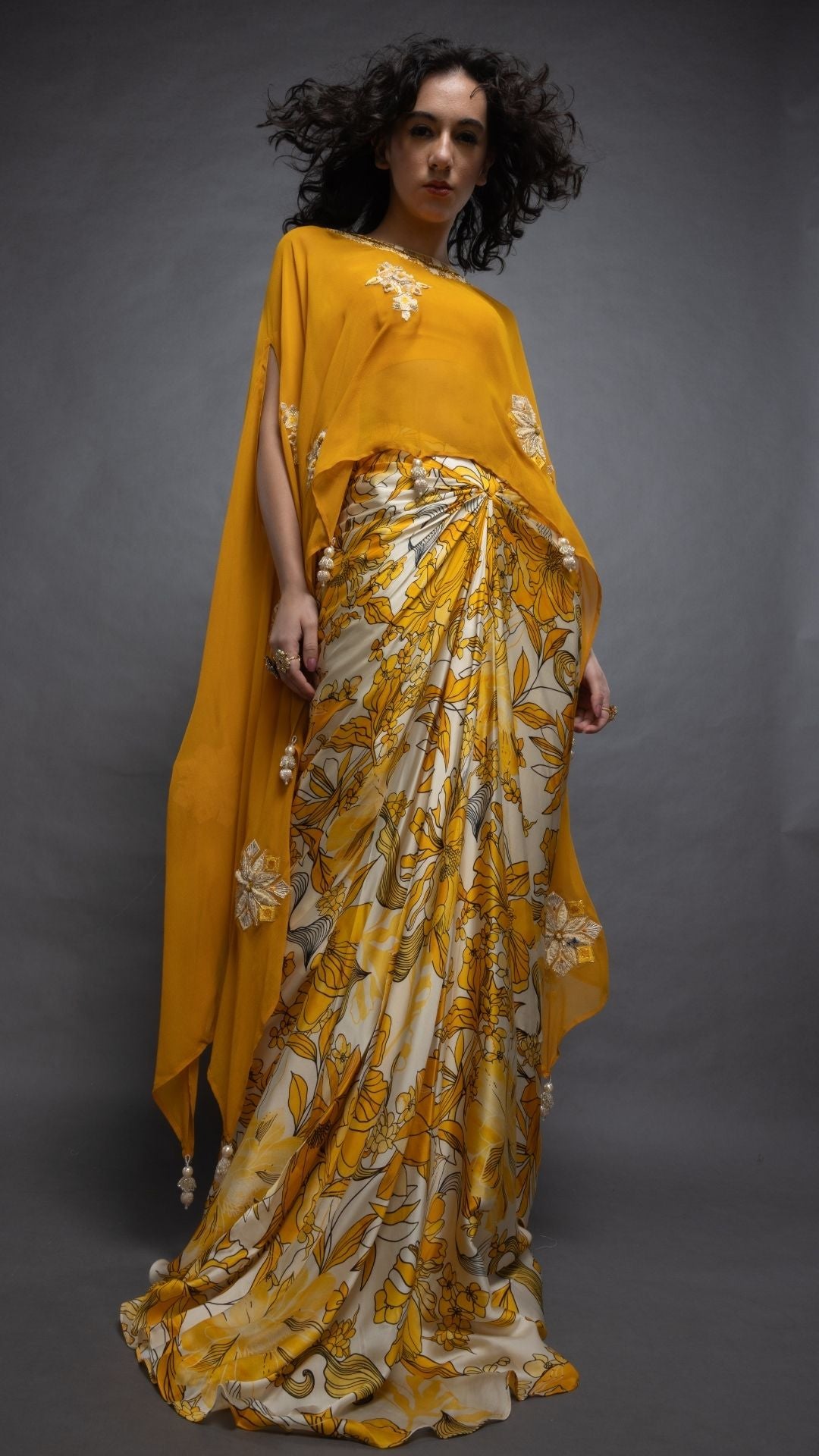 Mustard Embroidered Short Closed Neck Poncho with A Bustier and Floral Abstract Printed Drape Skirt