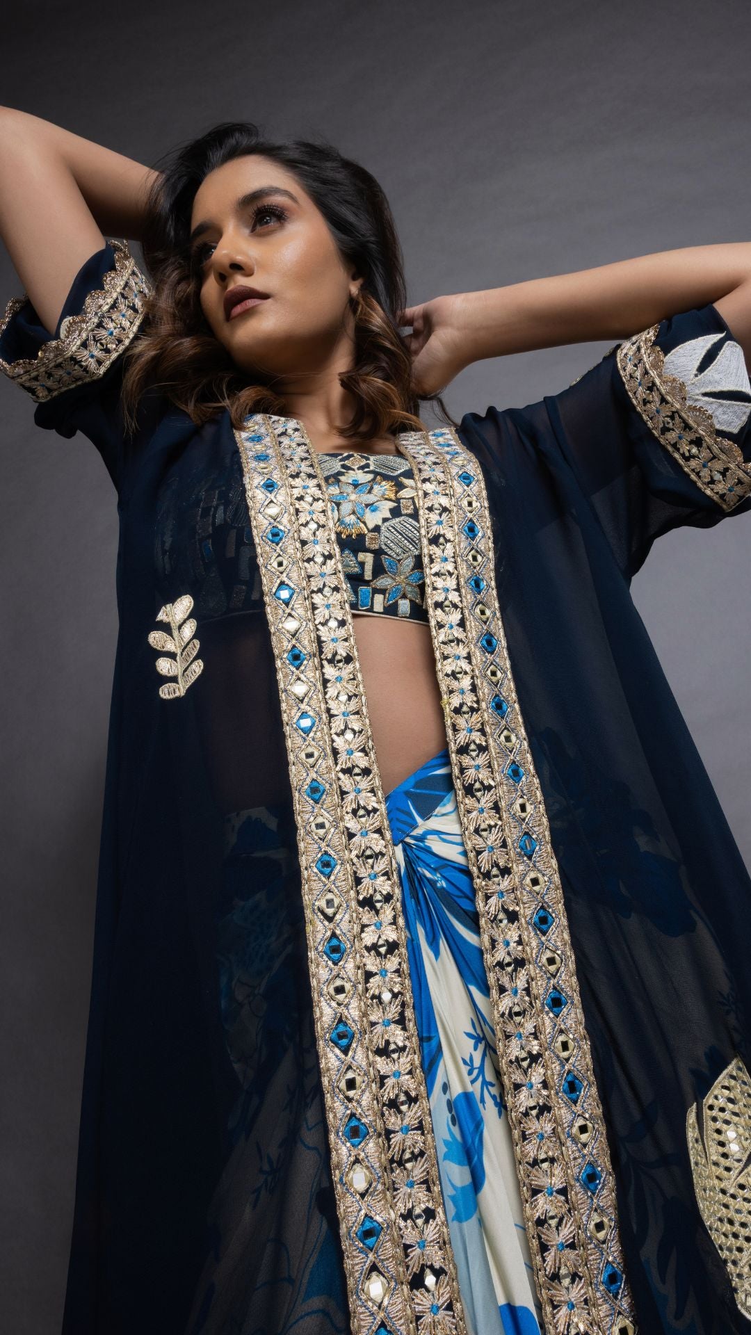 Solid Blue Embroidered Waterfall Cape with Embroiderd Bustier and Abstract Floral Printed Drape Skirt