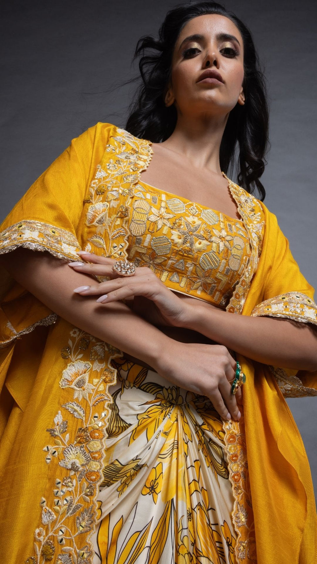 Musturd Silk Cutwork Cape with Embroidered Bustier and Printed Modal Drape Skirt