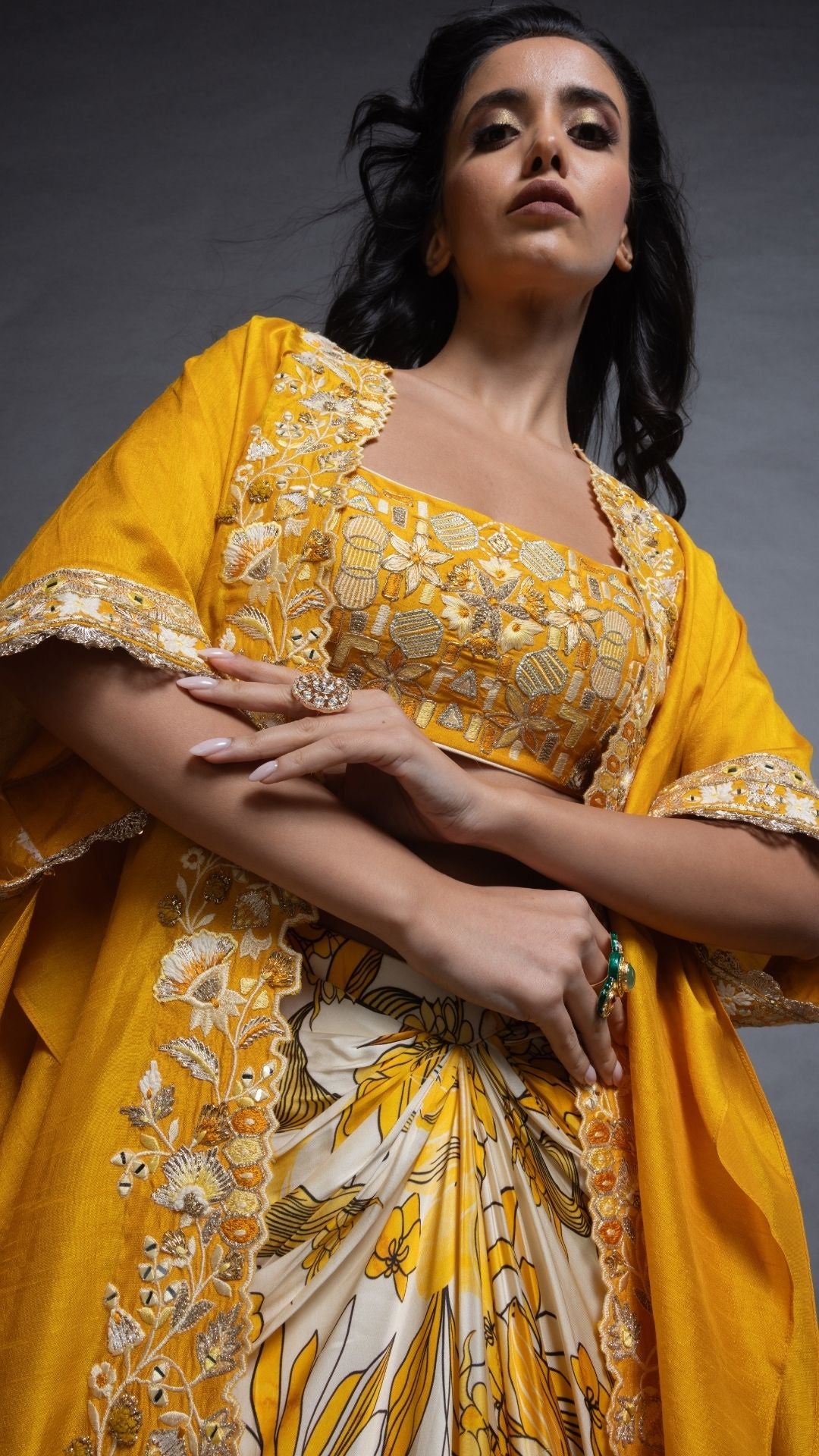 Musturd Silk Cutwork Cape with Embroidered Bustier and Printed Modal Drape Skirt